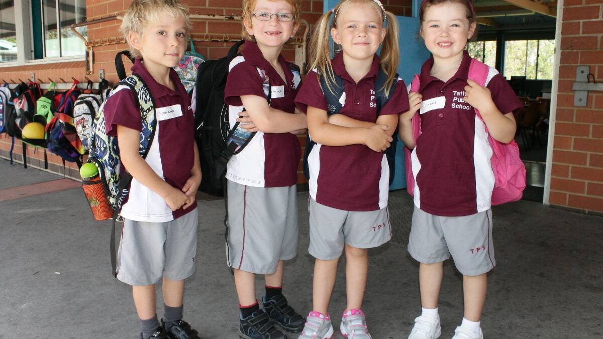 TATHRA: New Tathra Primary School Kindergarten pupils (from left) Henry Baxter, Cooper Finnegan, Mia Brown and Lani Child take their first excited steps to school this week. 