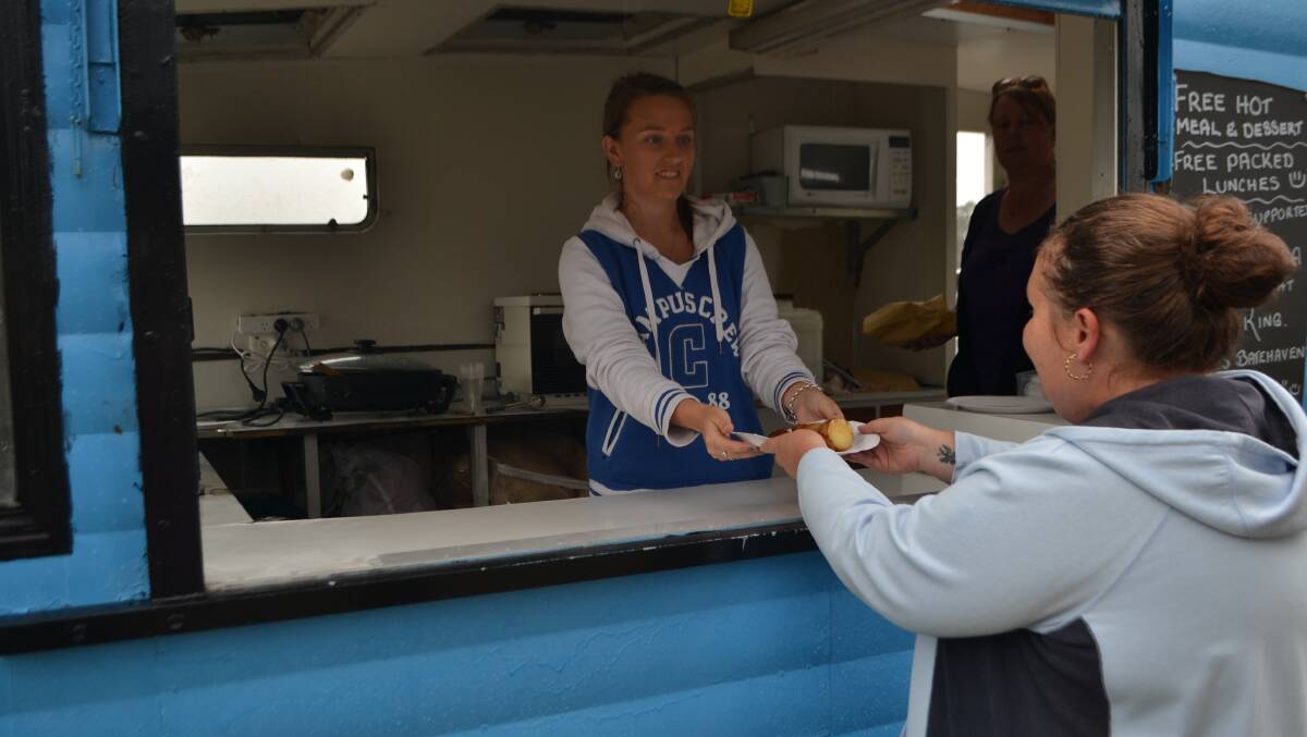 EUROBODALLA: Emergency accommodation facilities are overflowing and welfare services are reporting increased hardship. Pictured is Batemans Bay Soup Kitchen volunteer manager Skye McDermott serving food at twice-weekly service at Corrigans. 