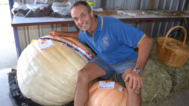 COBARGO: Cobargo Show Society committee member Graham Parr and his 163kg pumpkin that won Champion Agricultural Exhibit at the Cobargo Show.
 