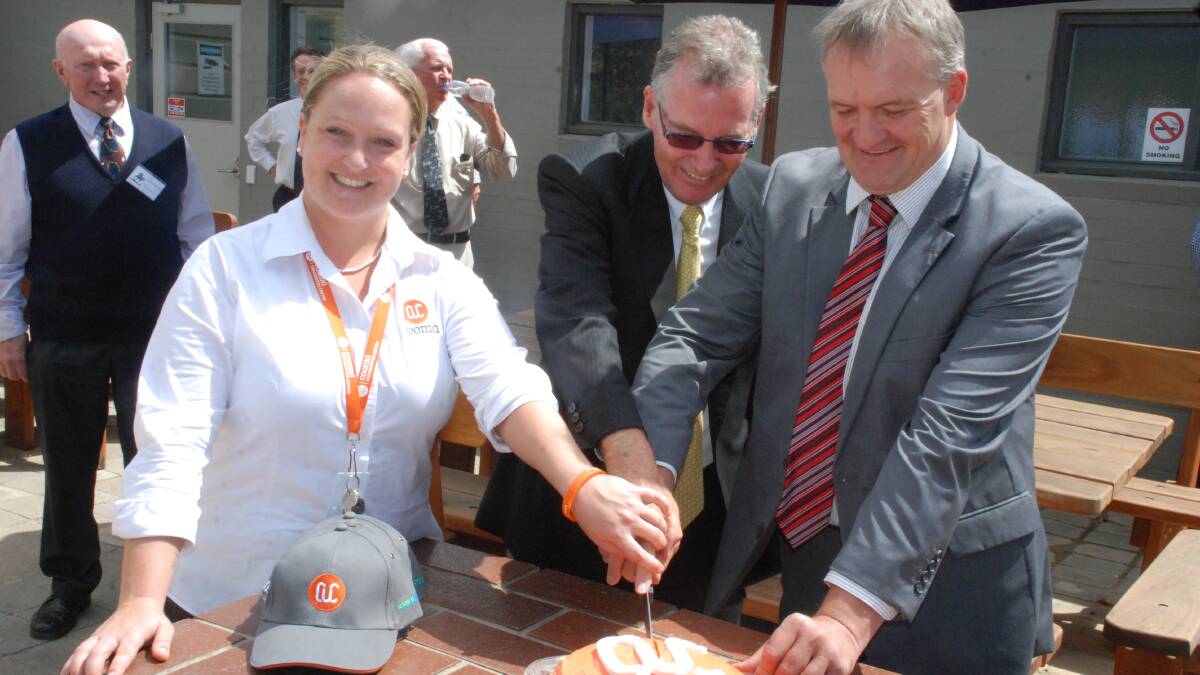 
COOMA: Cooma University Centre coordinator Zoe Dawson helps Snowy Hydro chairman Bruce Hogan and Cooma mayor Dean Lynch cut the Centre’s first birthday cake at a special community celebration. The Centre now has 83 enrolled students.
