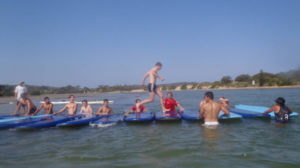 Canberra Raiders rugby league players hit Broulee Beach for boot camp. PICTURE: Surf the Bay Surf School  