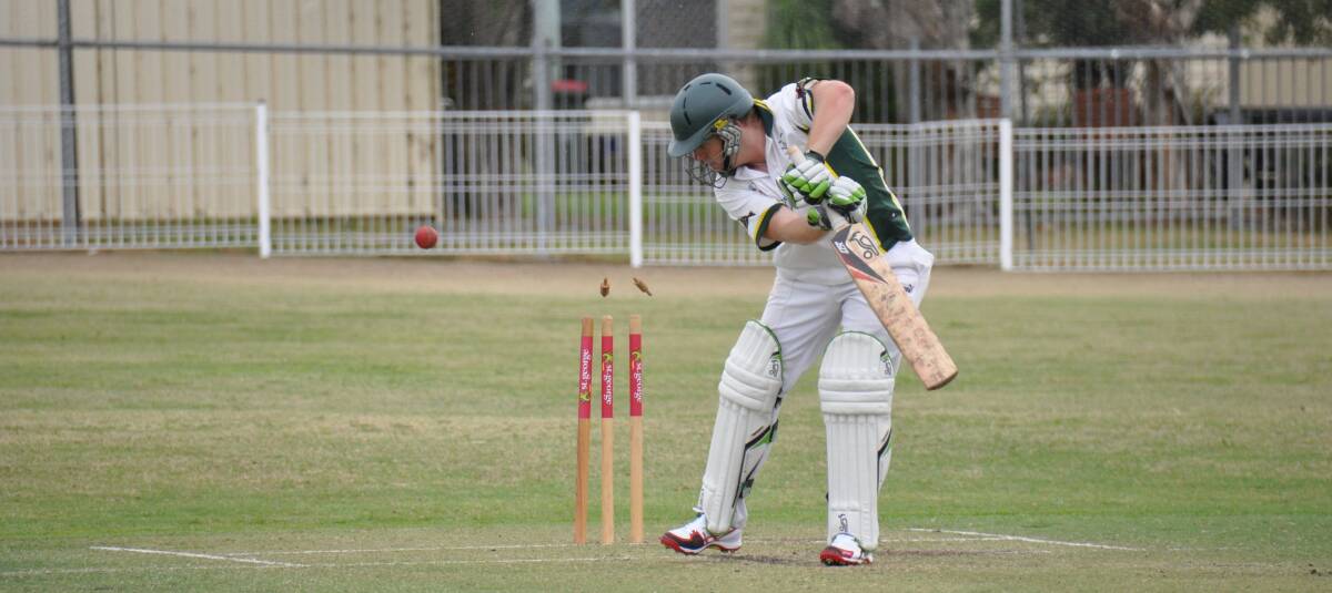 NOWRA: : Shoalhaven Ex-Servicemen batsman Simon Schmotz looks at the unpleasant site after being bowled by Bay and Basin skipper Jonathan Hill in first grade on Saturday. Photo: PATRICK FAHY   
 