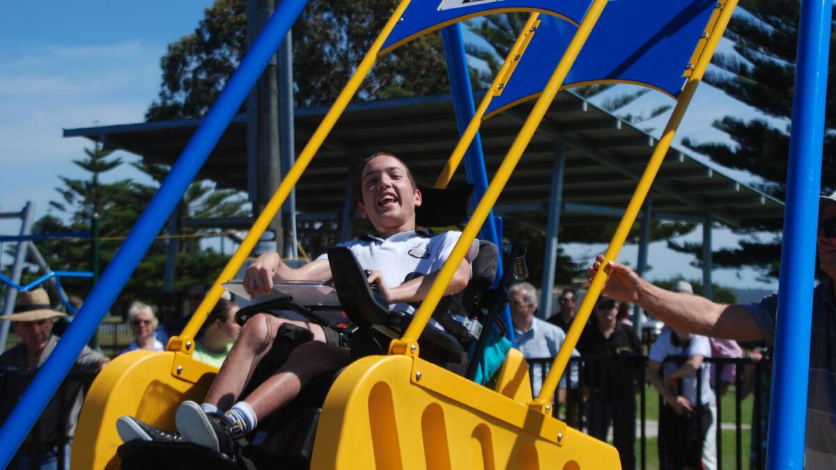 Tyson Martin was one of the first to test out the Liberty Swing, at Corrigans Reserve, which forms part of a wider plan for an entire all-abilities playground.