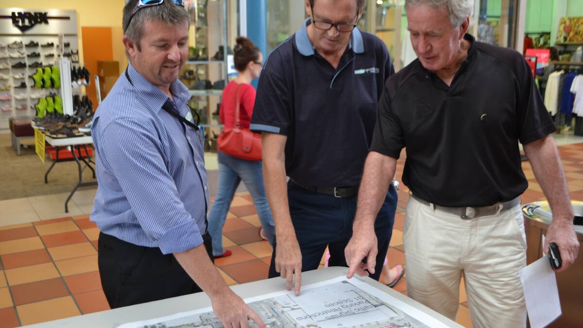 LIGHT TALK: Council’s divisional manager of technical services Greg Miller, mayor Lindsay Brown and resident Kim Odgers discuss the plans for the traffic lights.
