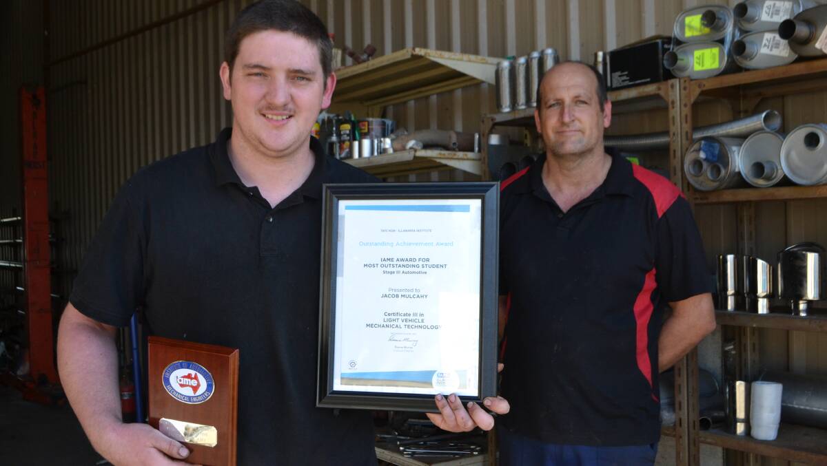 TOP JOB: Apprentice mechanic Jacob Mulcahy picked up the most outstanding student award through Nowra TAFE at his recent graduation. He is pictured with his boss, Moruya Mufflers manager Mick Watts.