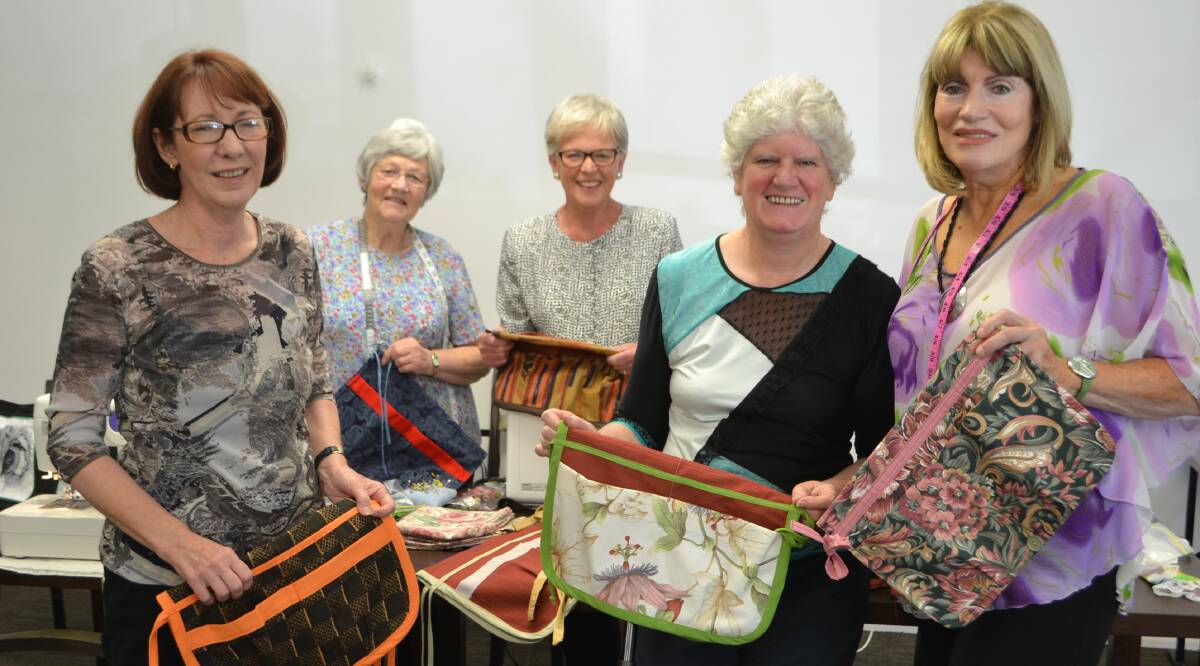 SEWN UP: Batemans Bay Sewers’ Jenny Craft, Leila Graham, Liz Perry, Helen Riedl and Diann Price are making walking frame bags to raise money for The Glen Residential Care Centre.