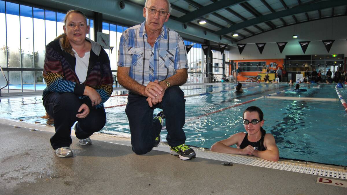 HARD YARDS: Grandfather Ray Sheiles and mother Charmaine Hogan drive Eddy Hogan to Ulladulla swimming pool two days a week so she can train in winter.