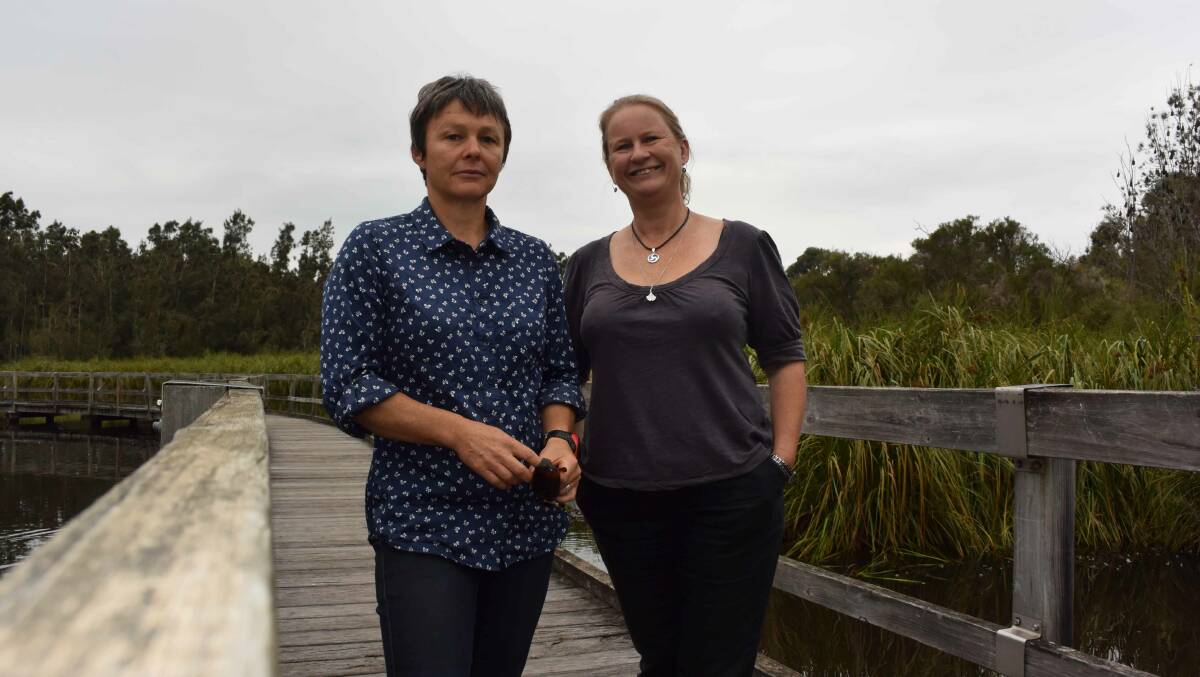 BAT BUDDIES: NSW Office of Environment and Heritage’s Joss Bentley and Lorraine Oliver at the Water Garden.