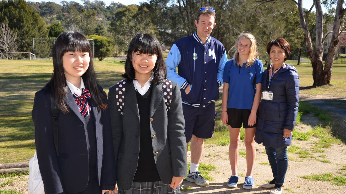 TALKING TOKYO: Japanese students Chiharu Nakamura and Kunika Sato will attend Moruya High School for the next three weeks. They are pictured with Japanese-language teacher Mattew Cusack, Year 8 student and host Ashley Dunne and teachers from Japan Fukuda Satomi. 