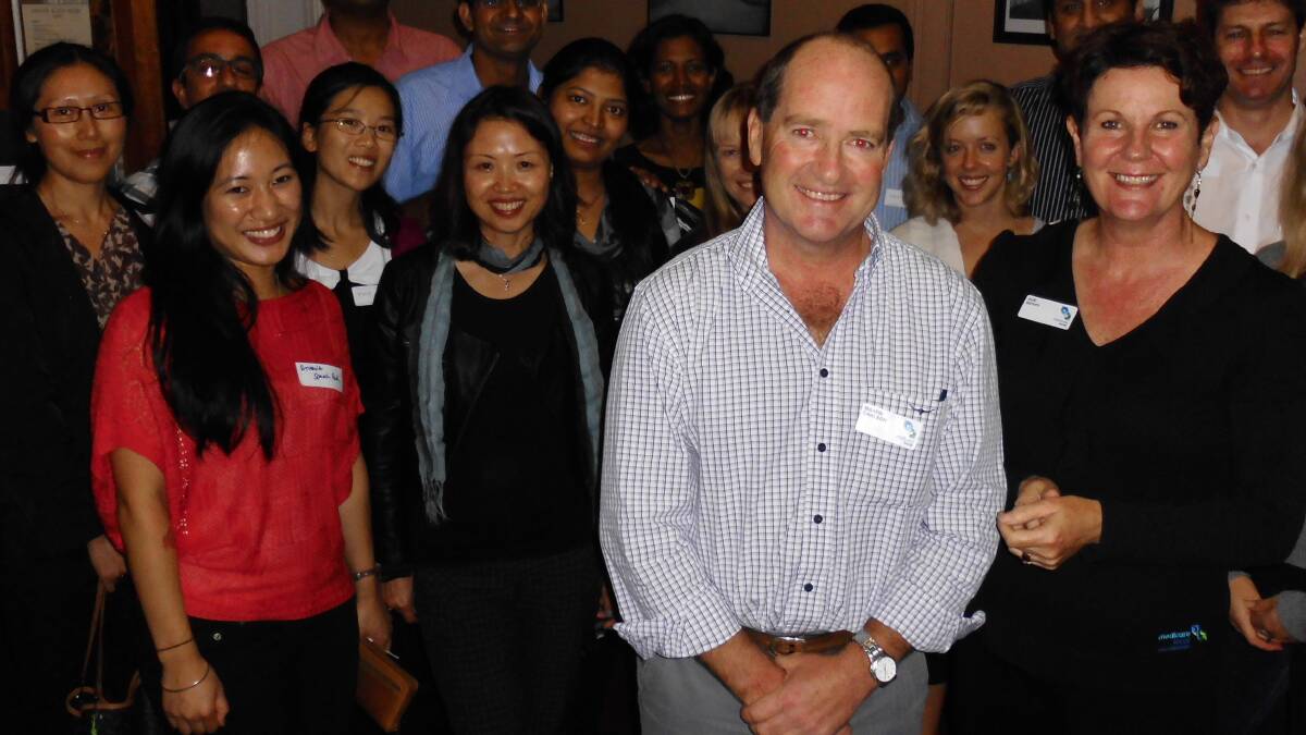 WARM WELCOME: Southern NSW Medicare Local chairman and Moruya GP Dr Martin Carlson (centre) and Medicare Local workforce manager Sue Berry (right) welcomed six new GPs and six registrars to the Eurobodalla at a social function held in Moruya on April 10. More than 30 health workers got there to meet their new colleagues.
