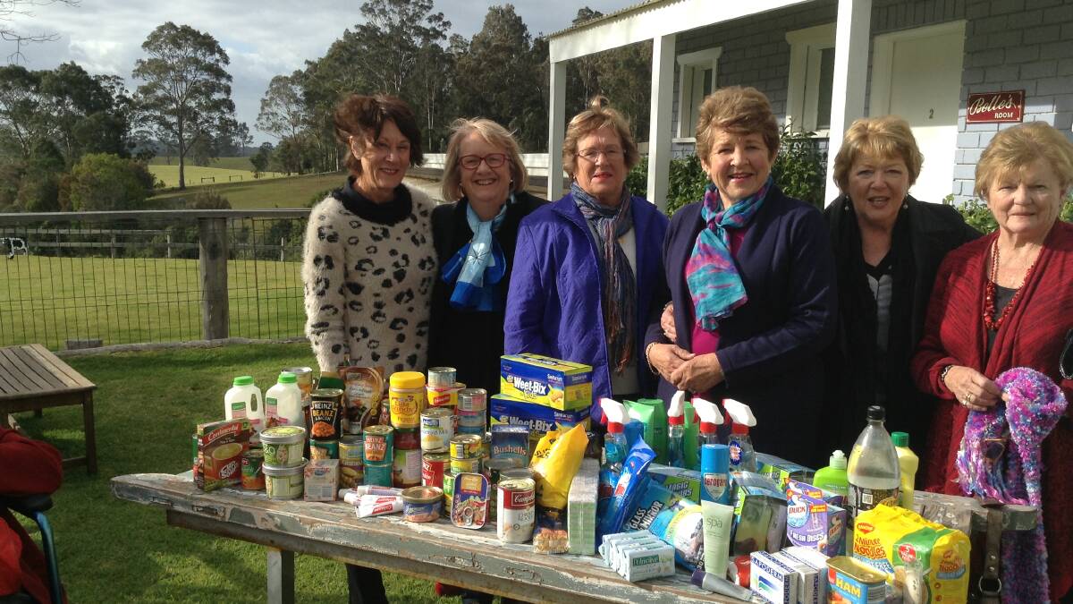 GENEROUS GIFTS: Jenny Best, Merrilyn Chilvers, Jan Tonks, Jenny Tweedie, Cindi McQulater and Fay Tye with the items they collected for Anglicare.
