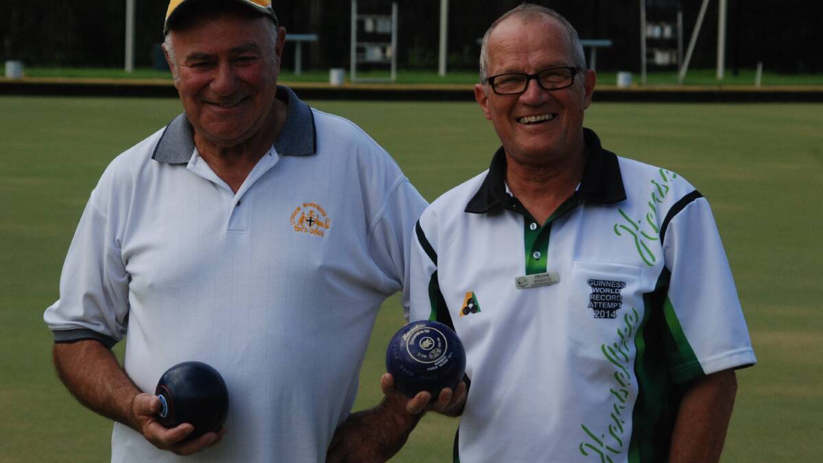 RECORD RUN: Record-seeking Frank Peniguel (right) with Malua Bay Bowling Club singles champion Bob Wren at Malua Bay last Friday.
