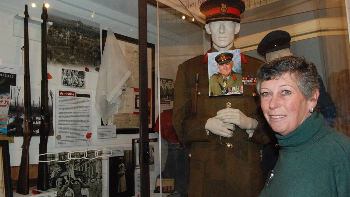 PRIDE OF PLACE: Former army signals operator Kerrie Rowe ensures the late Major-General Alan Stretton always looks his best. Major-General donated his full dress uniform and funds to The Old Courthouse Museum before his death two years ago.
