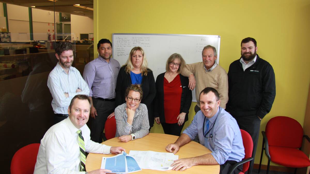 PLEASED: Eurobodalla Shire Council’s development assessment staff received favourable feedback about the services they provide. Pictured (seated) are development services manager Gary Bruce (left) and planning and sustainability director Lindsay Usher with assessment staff Rebecca Ireland, (standing) David Sheehan, Bryan Netzler, Kara Nelson, Lee Hamlyn, Mike Mcilveen and Mark Brain.