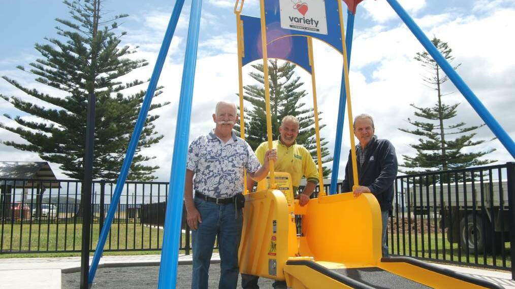 Fundraisers will expand on the Liberty Swing installed at Corrigans Reserve last year, with an all-abilities playground. Pictured is fundraisers Charles Stuart, left, and Geoff Fielding, right with Greg Read, of Christensen’s Fencing. 