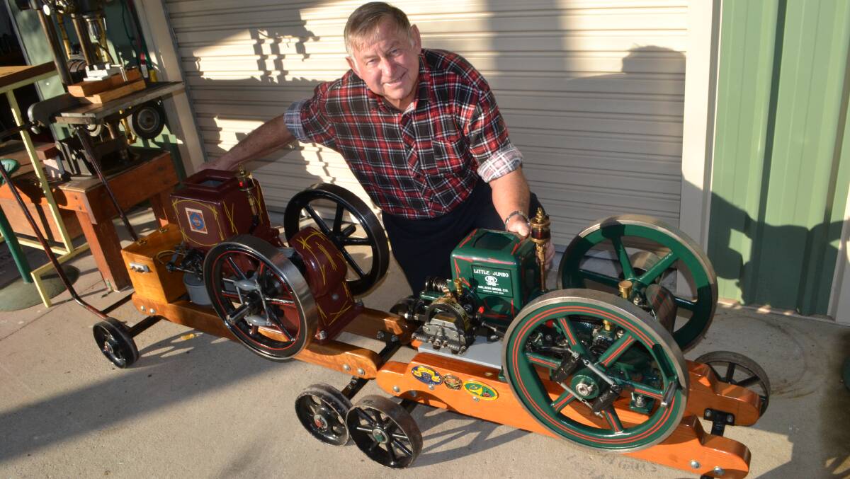 MACHINE MAN: Dave Hartwig with two of his historic stationary engines, built in 1917 and 1916, at his Tomakin home.