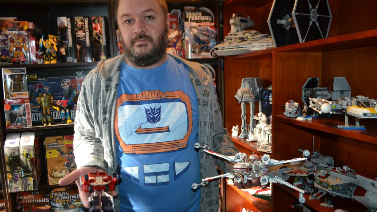 FATHER FIGURE: Ben Suters with some of his vast collection of action figures.