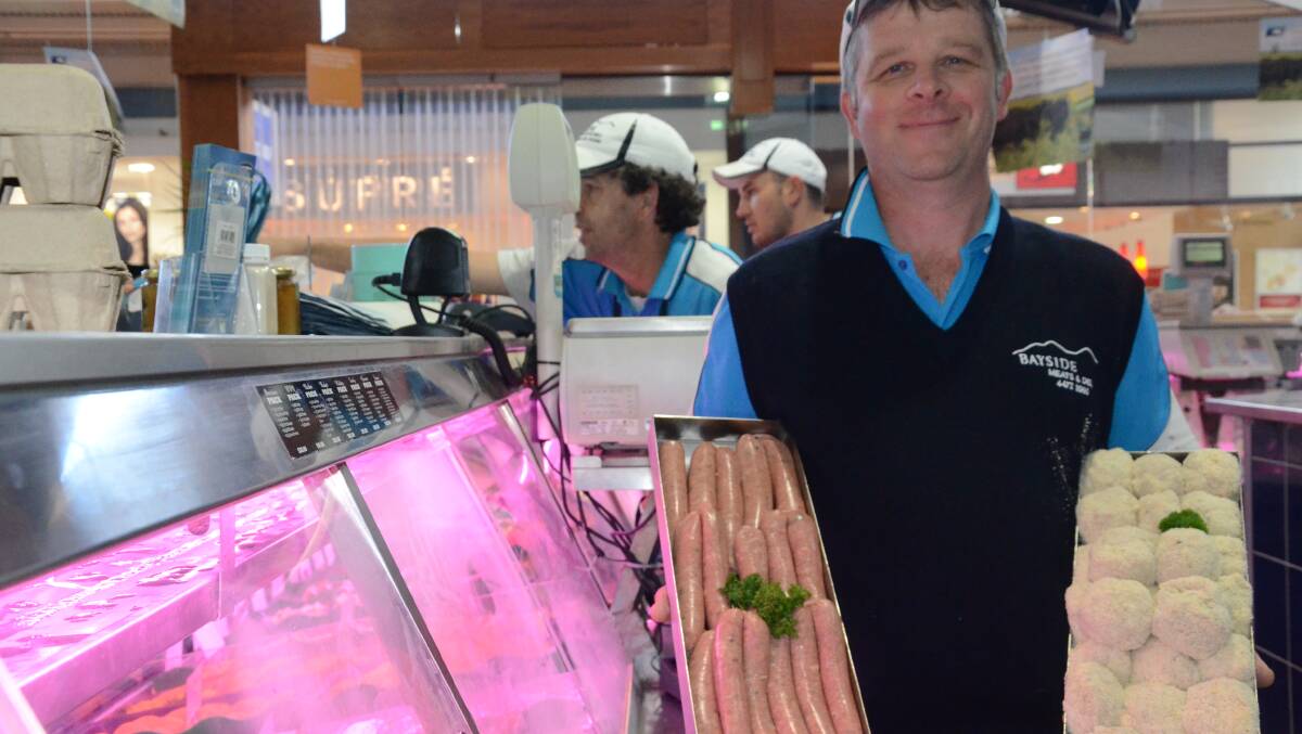 SAUSAGE SUPREMO: Bayside Meats and Deli manager Scott Thornton with the lamb sausages that have reached the NSW Sausage King finals. Owner Jason Funnell's chicken burgers were also placed third in the South Coast heats of the Australian Meat Industry Council event this month.