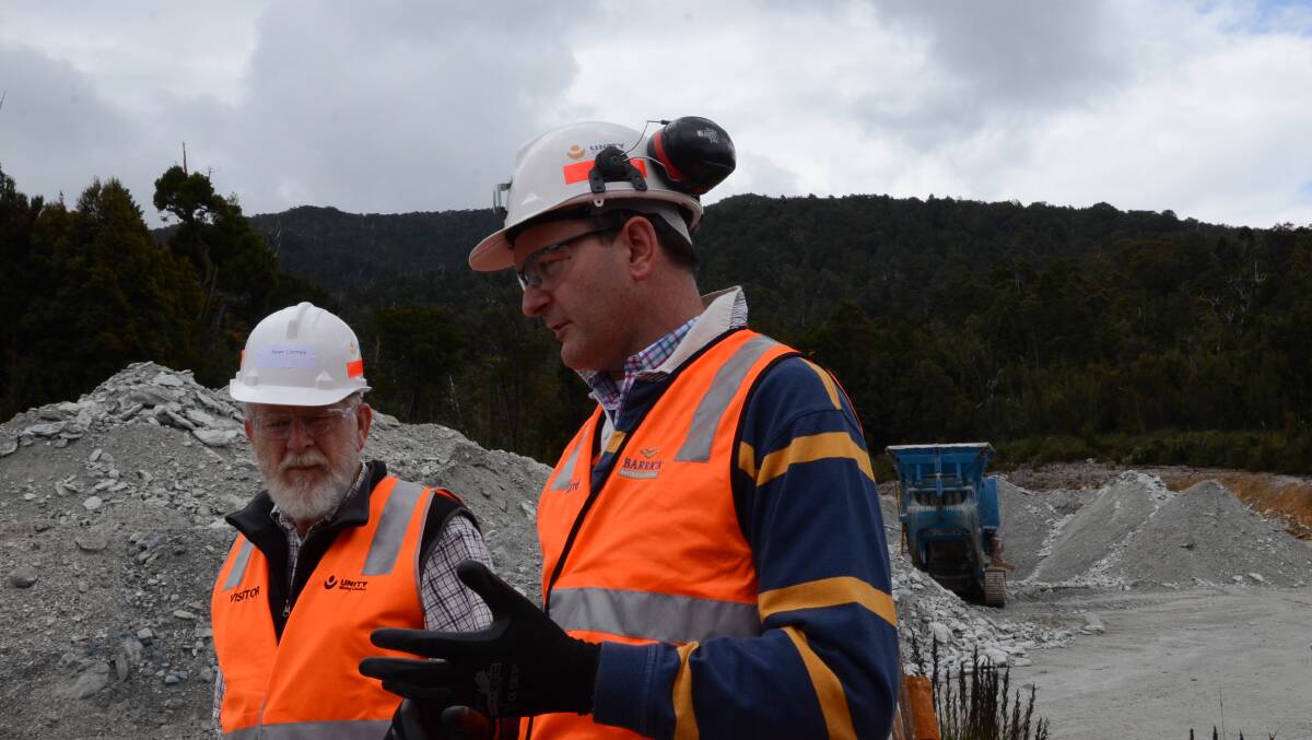 HAPPIER TIMES: Unity Mining CEO and managing director Andrew McIlwain, with Deua resident Peter Cormick, at the Unity's Tasmanian Henty Gold Mine in December.