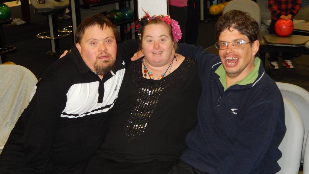 PARTY TIME: Robbie, Helena and James enjoy each other’s company at a recent Peer Support event.
