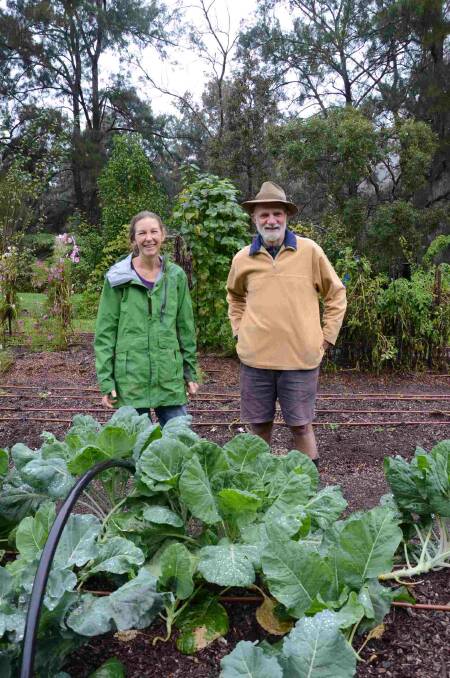 FIGHT BEARS FRUIT: Deua Valley neighbours Alison Walsh and Martyn Phillips, pictured in their shared vegetable garden by the Deua River, are pleased Unity Mining has withdrawn its proposal to process gold with cyanide upstream.