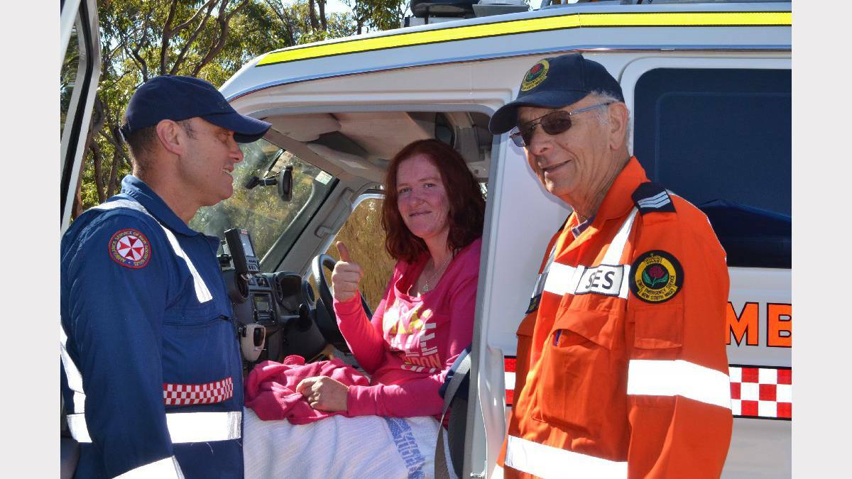 ULLADULLA: Paramedic Jason Watson and SES volunteer John Jones from Ulladulla with Lydia Johnson after she was missing for two nights at Yalwal. Picture: Bay Post
