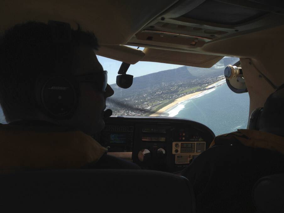 Bendigo Bank Aerial Patrol pilot Andrew Jones and observer Arty Zearo search the Illawarra coast for sharks. Picture: Andrew Pearson