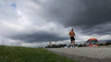 A man running under a cloudy sky at Flagstaff Hill on March 26, 2024 Picture by Sylvia Liber