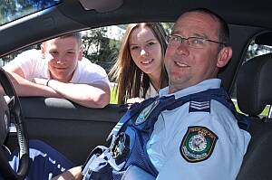 STAY SAFE:  Year 11 Batemans Bay High School students Tayla Moore and James Gillespie and Sergeant Brett Gruber, of Batemans Bay Highway Patrol, can see a need for a driver awareness program for young people.