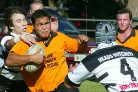 TOUGH DAY: Batemans Bay’s Gerard Dennis charges the Berry-Shoalhaven Heads defence at Berry last Saturday.