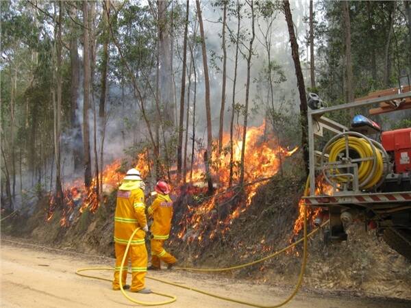ON FIRE: NSW Rural Fire Service Far South Coast Surf Beach crew conducting backburning on Dingo Trail in Budawang National Park last Friday.