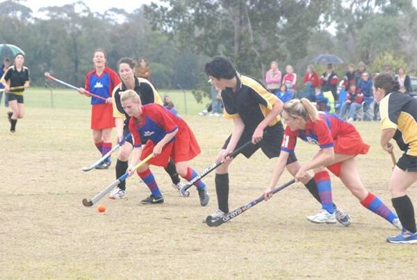 JUDGEMENT DAY:  Knights’ Lindy Hudson moves the ball up field with Chloe Hoffman, James Jeffery and Louisa Bonner in pursuit and Sarah Hockey looking on during the Eurobodalla Hockey grand final on Saturday.