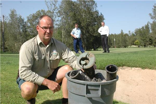 STUPID ATTACK: Catalina Country Club golf superintendent Tony Fogarty, Batemans Bay police officer Steve Millard and Catalina Country Club chief executive officer Richard Hogg inspect the course after a vandalism attack.