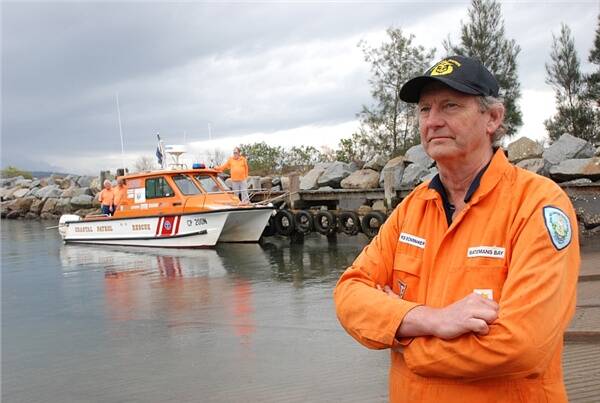 STRANDED:  Batemans Bay Royal Volunteer Coastal Patrol members Dave Greenshields, Carl Stewart and Bruce Taylor on the Noosa Cat which is now out of action, with divisional commander Rob Bowmaker.