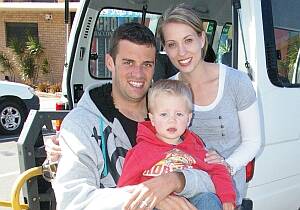 DADDY’S HOME : Cameron and Jade McMullen and their youngest son Sonny were out and about in the Ulladulla shopping centre on Monday. The generosity of the community has allowed the couple to purchase a van to transport Cam in his wheelchair.