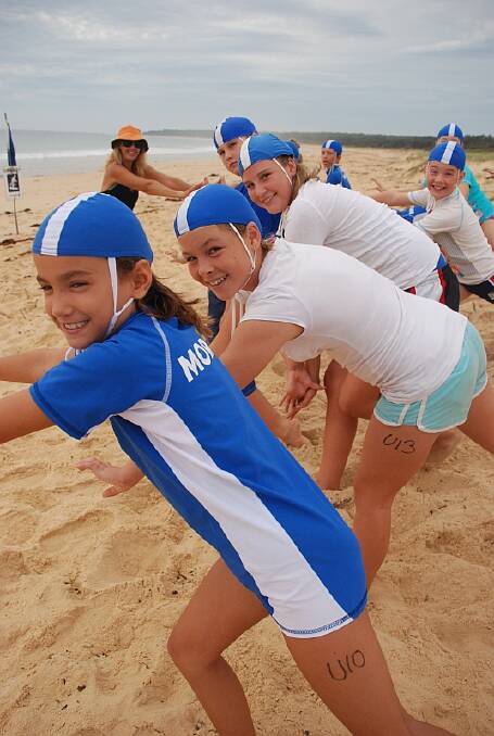 CONFIDENT SEA CREATURES:  Moruya Nippers (from left) Sally Kennedy, Breanna Bailey and Alison Baker lead the warm-up exercises at the mini carnival.