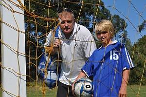 FUN FOOTY:  Eurobodalla Football Association development coach Steve Enfield with 10-year-old player Jake Lyttle at Captain Oldrey Park on Wednesday.