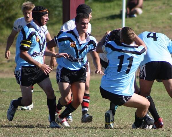 SHARKS IN ACTION:  Moruya Sharks Bronson Horvath, Will Roqica and Billy Elliott tackling a Bega player, with Josh Stewart on the right, at the pre-season match against Bega on Sunday.