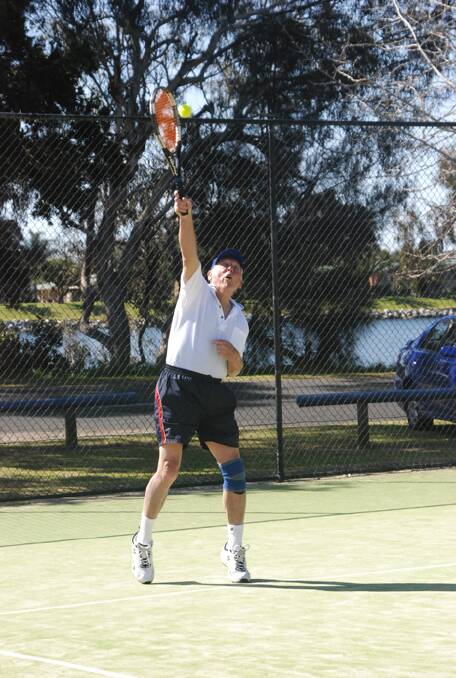 DOUBLES WINNER:  Mogo’s Phil Pearson slams down a serve during the Moruya Seniors Tennis Tournament on Saturday.