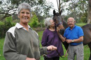 HAPPILY EVER AFTER:  Shirley Pearson (left) and husband Chicka trained Stanton for years, and then found him a loving home with Mogo couple Carol Osling (centre) and Alf Upton (right).