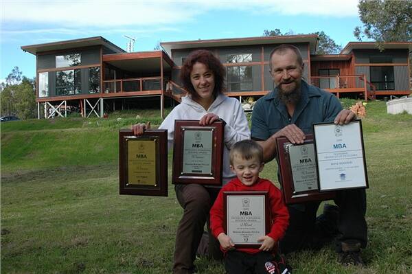 HOUSE PROUD:  Kylie Lipp, Charlie Bidgood and Ross Bidgood with the five awards Bidgood Building Pty Ltd won at the Master Builders Association South East Regional Awards on Saturday night.