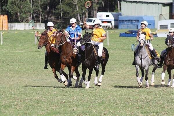 POLOCROSSE TUSSLE:  Dinah Haynes from Eurocoast is flanked by Julie Murray and Alison Carey from the Milton/Ulladulla club in a C grade mixed match. Photo: ANTHONY WILLIS PHOTOGRAPHY.