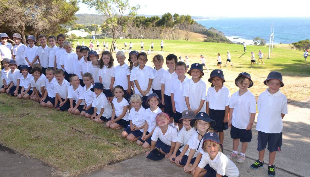 NAROOMA: The Year 1 group at Narooma Public School on their second day at school with the Year 5s exercising in the background.