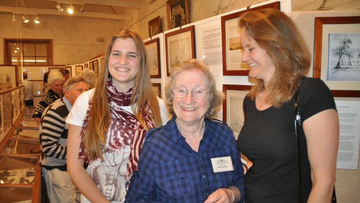 MERIMBULA: Historic sketches by Oswald Brierly  drew a big crowd to Merimbula’s Old School Museum and pictured enjoying the exhibition were Shirley Bazley, of Tura Beach, with granddaughter Sarah Bazely-Smith and daughter Nichola Bazely-Smith.