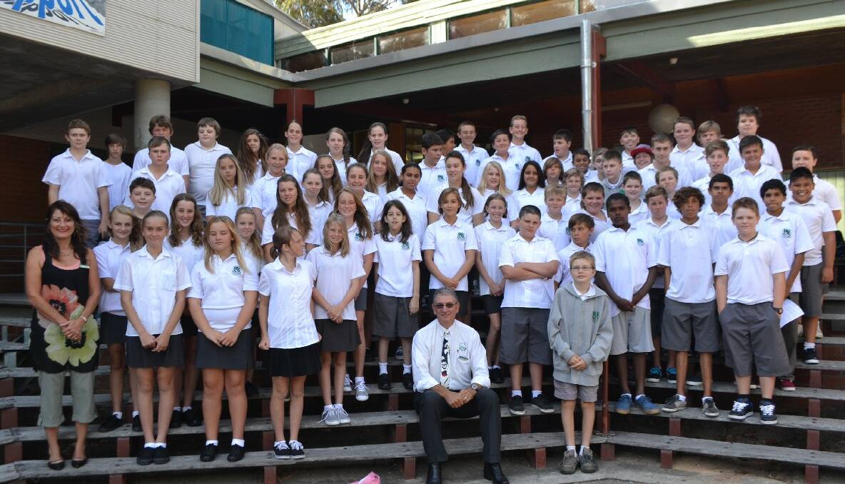 NAROOMA: The Year 7 group that started at Narooma High School this week with principal Tony Fahey in the foreground and year advisor Lyn Schroder to the left.