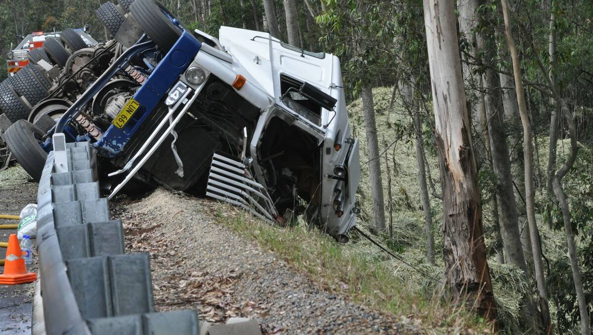 HAY BALE MAYHEM: The scene Monday afternoon after a truck lost control on a bend and tipped over south of Batemans Bay.