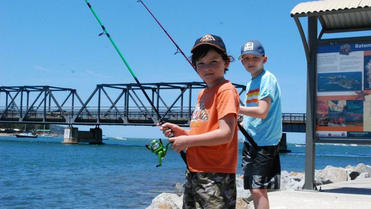 LINES TIGHT: William and Luke Tarlinton, of Hunters Hill in Sydney, try a spot of fishing on the Clyde River at Batemans Bay.
