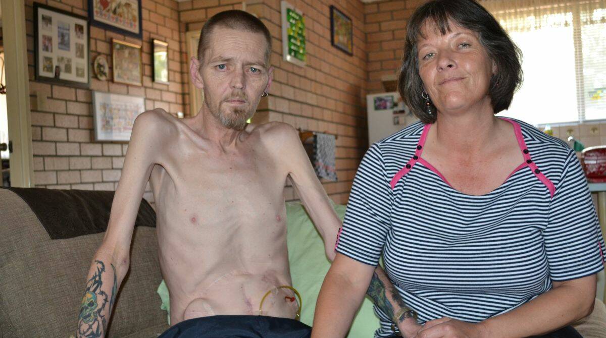 LOSE WEIGHT: Gary Humpherston has been told he needs to lose another six kilos before the health department will give him a vital total parenteral nutrition (TPN) drip, which is used to help patients increase their weight. He is pictured with his supportive partner Jane Boege.