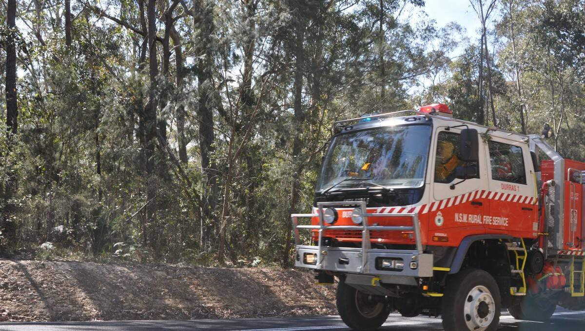 Rural Fire Service crews battled a bushfire at South Durras yesterday.