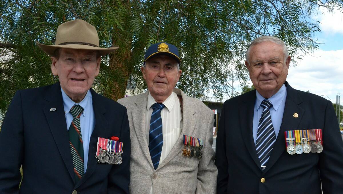 Sandy Currie, Bob Moore and Graham Collins at the Batemans Bay Honour stone.